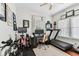 Bright office space features a treadmill, desk, and stationery bikes for a convenient workout area at home at 3405 W Palmira Ave, Tampa, FL 33629