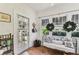Sunroom with tile flooring, decorative wreaths, and ample natural light at 3405 W Palmira Ave, Tampa, FL 33629