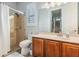Bathroom featuring a walk-in shower, vanity with storage, and a neutral color scheme at 3656 Kalanchoe Pl, Wesley Chapel, FL 33544