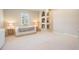A simple, yet stylish bedroom with neutral color palette and ample natural light from window at 3656 Kalanchoe Pl, Wesley Chapel, FL 33544