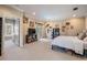 Spacious and bright main bedroom boasting a door to the outdoor deck, and stylish decor at 3656 Kalanchoe Pl, Wesley Chapel, FL 33544