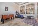 Spacious recreation room with foosball table, treadmill, and seating area, perfect for entertainment and fitness at 3656 Kalanchoe Pl, Wesley Chapel, FL 33544