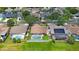 Aerial view of home with pool and screened enclosure, showcasing its prime location at 3834 102Nd N Pl, Clearwater, FL 33762