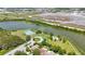 Scenic aerial shot showcases community park featuring tennis courts and waterfront access near homes at 3834 102Nd N Pl, Clearwater, FL 33762