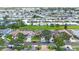 Expansive aerial view of a well-maintained residential community with lush green lawns and mature trees at 3834 102Nd N Pl, Clearwater, FL 33762
