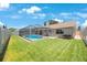 Well-maintained backyard with screened pool, offering a private outdoor space for relaxation and fun at 3834 102Nd N Pl, Clearwater, FL 33762