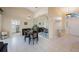 Dining area with tile floors, mirror accent wall, and access to the kitchen at 3834 102Nd N Pl, Clearwater, FL 33762