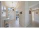 Inviting home entryway with tile floors, high ceiling, and access to other rooms at 3834 102Nd N Pl, Clearwater, FL 33762
