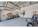 Spacious two-car garage with laundry area, storage, and epoxy flooring offers convenience and functionality at 3834 102Nd N Pl, Clearwater, FL 33762