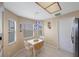 Eat-in kitchen with breakfast table and chairs, white cabinetry, and natural light at 3834 102Nd N Pl, Clearwater, FL 33762