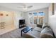 Cozy living room with wood-look floors, ample windows, and a comfortable couch at 3834 102Nd N Pl, Clearwater, FL 33762