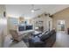 Living room with tile floors, fireplace, ceiling fan, sliding glass doors to the patio at 3834 102Nd N Pl, Clearwater, FL 33762