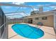Backyard pool with screened-in lanai, perfect for outdoor entertaining and relaxation at 3834 102Nd N Pl, Clearwater, FL 33762