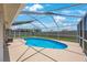 Sparkling pool with screened enclosure provides a private oasis for relaxation and recreation at 3834 102Nd N Pl, Clearwater, FL 33762