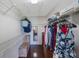 Walk-in closet with shelving, hanging rods, and hardwood floors at 3834 102Nd N Pl, Clearwater, FL 33762