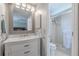 Bathroom featuring a modern vanity and a walk-in shower at 3968 Orchard Hill Cir, Palm Harbor, FL 34684