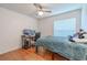 Bedroom featuring hardwood floors and a ceiling fan at 3968 Orchard Hill Cir, Palm Harbor, FL 34684