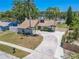 Beautiful single Gathering home featuring a private driveway, mature landscaping and a classic suburban design at 3968 Orchard Hill Cir, Palm Harbor, FL 34684
