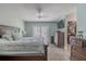 Main bedroom featuring dresser, walk-in closet, ceiling fan and sliding door at 3968 Orchard Hill Cir, Palm Harbor, FL 34684