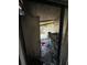 View of a fire-damaged back patio through a doorway, showing debris at 4010 Cedarlimb Ct, Tampa, FL 33614
