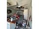 Fire damaged kitchen area, with debris scattered on the counter and floor at 4010 Cedarlimb Ct, Tampa, FL 33614