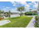 Waterfront property with a large, well-manicured yard, offering serene water views and relaxing outdoor space at 4041 Star Island Dr, Holiday, FL 34691