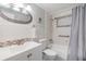 Bathroom featuring a single sink vanity and a shower-tub combination at 4041 Star Island Dr, Holiday, FL 34691