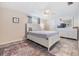 Comfortable bedroom with ceiling fan, large dresser, and neutral decor at 4041 Star Island Dr, Holiday, FL 34691