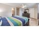 Comfortable bedroom with ceiling fan, large dresser, and neutral decor at 4041 Star Island Dr, Holiday, FL 34691