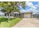 Charming single-story home with stone accents, attached garage, and well-maintained lawn at 4041 Star Island Dr, Holiday, FL 34691