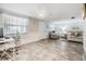 Open concept living area with an attached office space and neutral-toned furnishings at 4041 Star Island Dr, Holiday, FL 34691