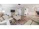 Cozy living room with neutral paint, updated flooring, and comfortable seating at 4041 Star Island Dr, Holiday, FL 34691