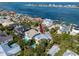 Aerial view of a beautiful waterfront community and a home that includes a pool and private boat dock at 405 8Th N Ave, Tierra Verde, FL 33715