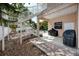 Backyard with patio, two barbecues covered in black, and a staircase going to the upper level at 405 8Th N Ave, Tierra Verde, FL 33715
