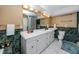 Bathroom features a double sink vanity, glass block shower, tile floor and excellent lighting at 405 8Th N Ave, Tierra Verde, FL 33715