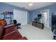 Well-lit bedroom with blue walls, double closet and access to the outdoor area at 405 8Th N Ave, Tierra Verde, FL 33715