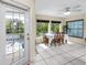Breakfast nook featuring lots of natural light, white tiled floor, and a view of the lanai at 405 8Th N Ave, Tierra Verde, FL 33715