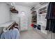 Custom closet with ample shelving, hanging space, and a unique round window for natural light at 405 8Th N Ave, Tierra Verde, FL 33715