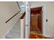 This entryway features a carpeted staircase and an elevator, adding convenience and accessibility to the home at 405 8Th N Ave, Tierra Verde, FL 33715