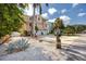 Single Gathering home with a well-manicured lawn, 2-car garage, and tropical landscaping at 405 8Th N Ave, Tierra Verde, FL 33715