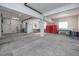 Large garage or workshop with concrete flooring, overhead lighting, and built in shelves at 405 8Th N Ave, Tierra Verde, FL 33715
