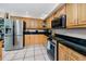 Well-equipped kitchen with stainless steel appliances, granite countertops, and ample storage space at 405 8Th N Ave, Tierra Verde, FL 33715