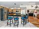 Kitchen features a breakfast bar with seating, stainless appliances, and granite countertops at 405 8Th N Ave, Tierra Verde, FL 33715