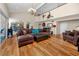 Spacious living room with hardwood floors, a chandelier, and large sectional sofa at 405 8Th N Ave, Tierra Verde, FL 33715