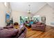 Spacious living room with vaulted ceilings, hardwood floors, and modern decor at 405 8Th N Ave, Tierra Verde, FL 33715
