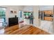 Open floor plan connecting the living room to the breakfast nook and kitchen with breakfast bar at 405 8Th N Ave, Tierra Verde, FL 33715
