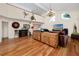 Open-concept living room with hardwood floors, vaulted ceilings, and decorative coastal-themed accents at 405 8Th N Ave, Tierra Verde, FL 33715