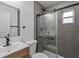This bathroom features a bathtub, shower with glass door, and modern fixtures at 4210 Palm Dr, Punta Gorda, FL 33950