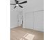 This spacious bedroom features light wood floors, closet space, and a ceiling fan at 4210 Palm Dr, Punta Gorda, FL 33950