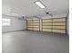 This is an empty garage with concrete floors and two garage doors at 4210 Palm Dr, Punta Gorda, FL 33950